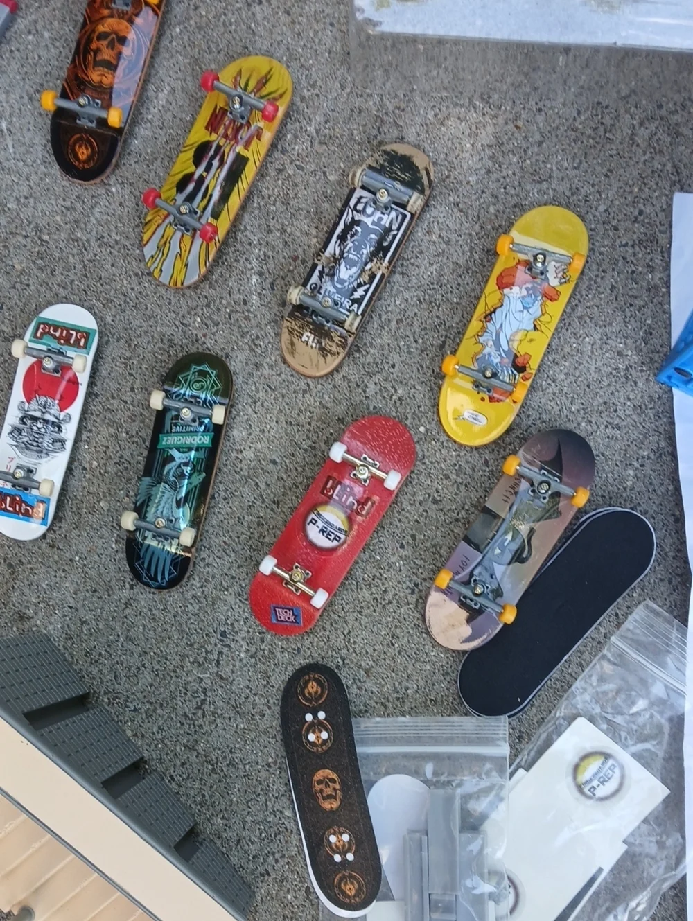 Tech Deck finger skateboard lot, includes multiple miniature boards